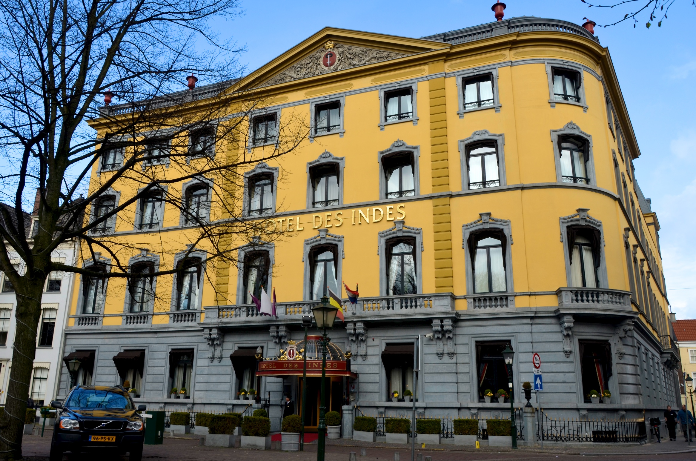 an older building painted in yellow and grey