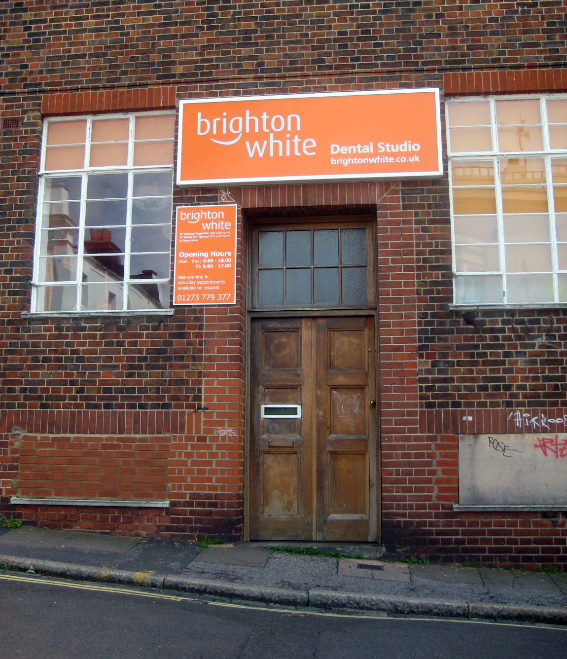 brick building with a sign that reads brighton white