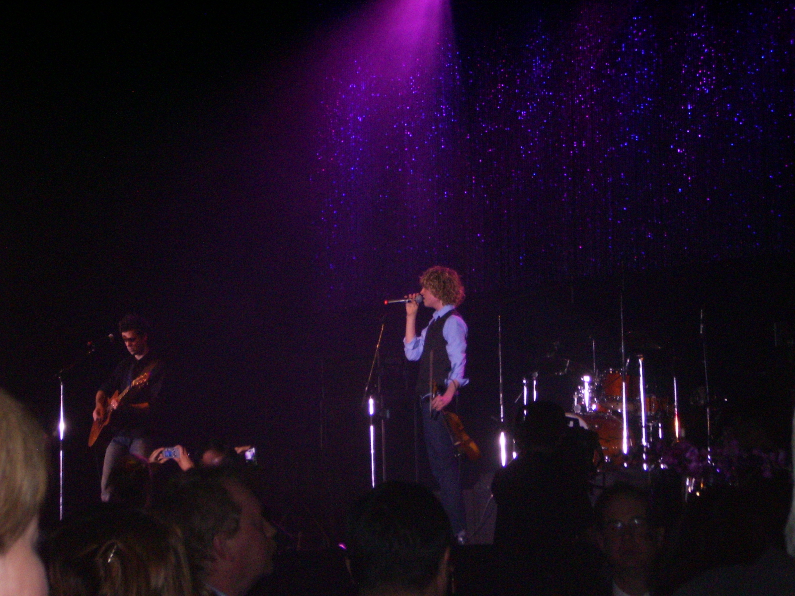 a band plays at a concert on stage