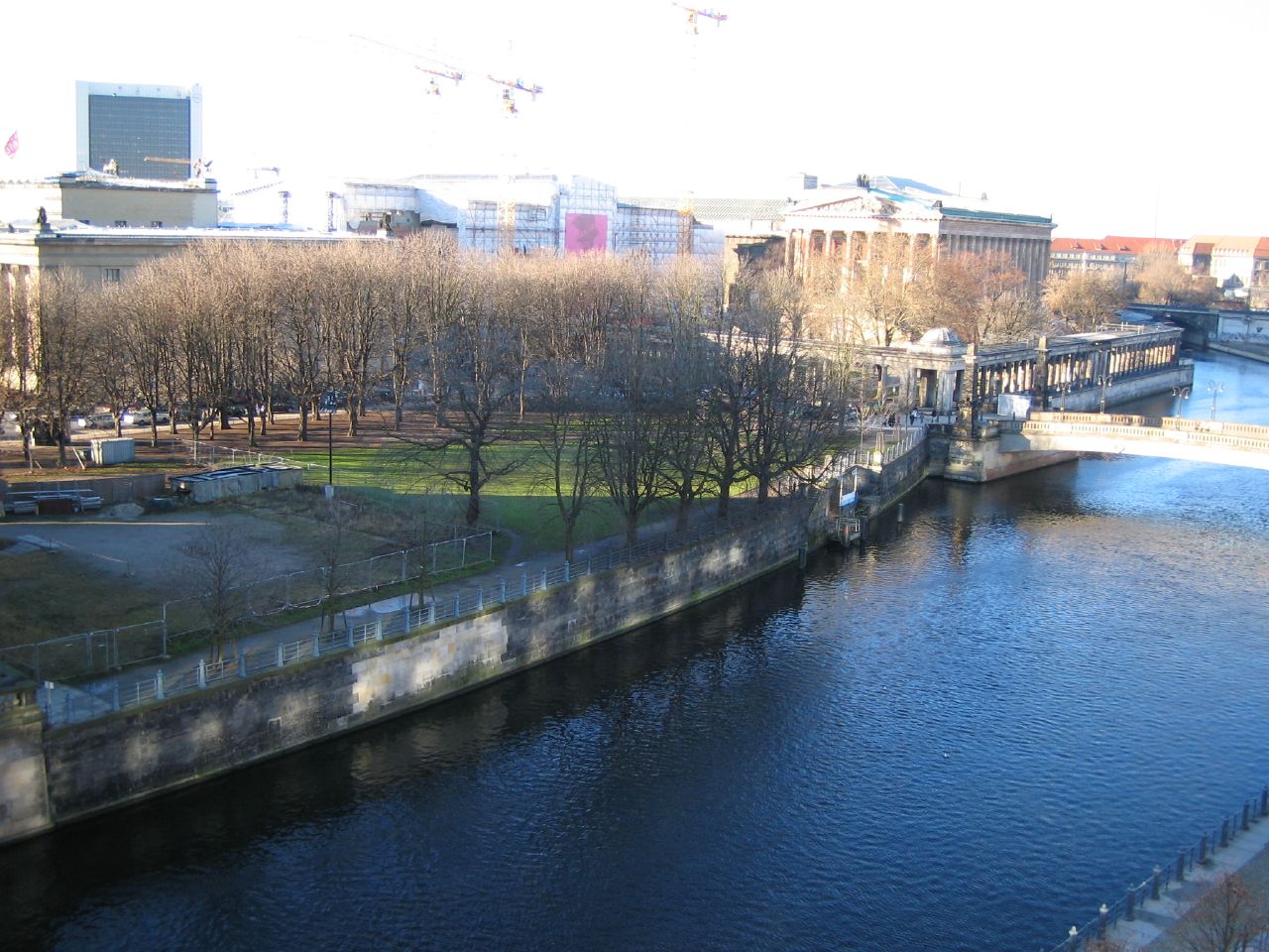 a river near some buildings and a bridge