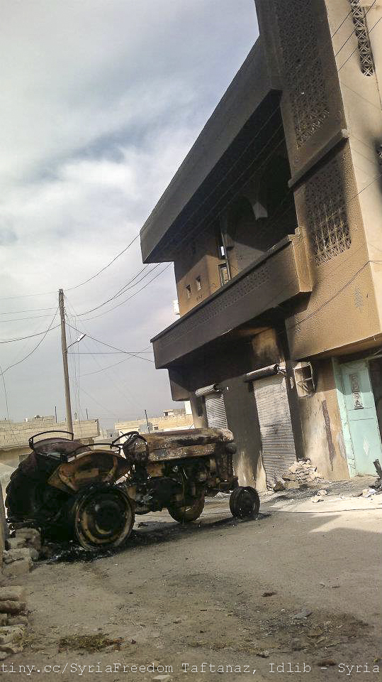 an old antique truck parked next to a building