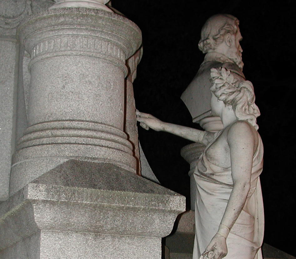 a statue of a person who is pointing out to the side