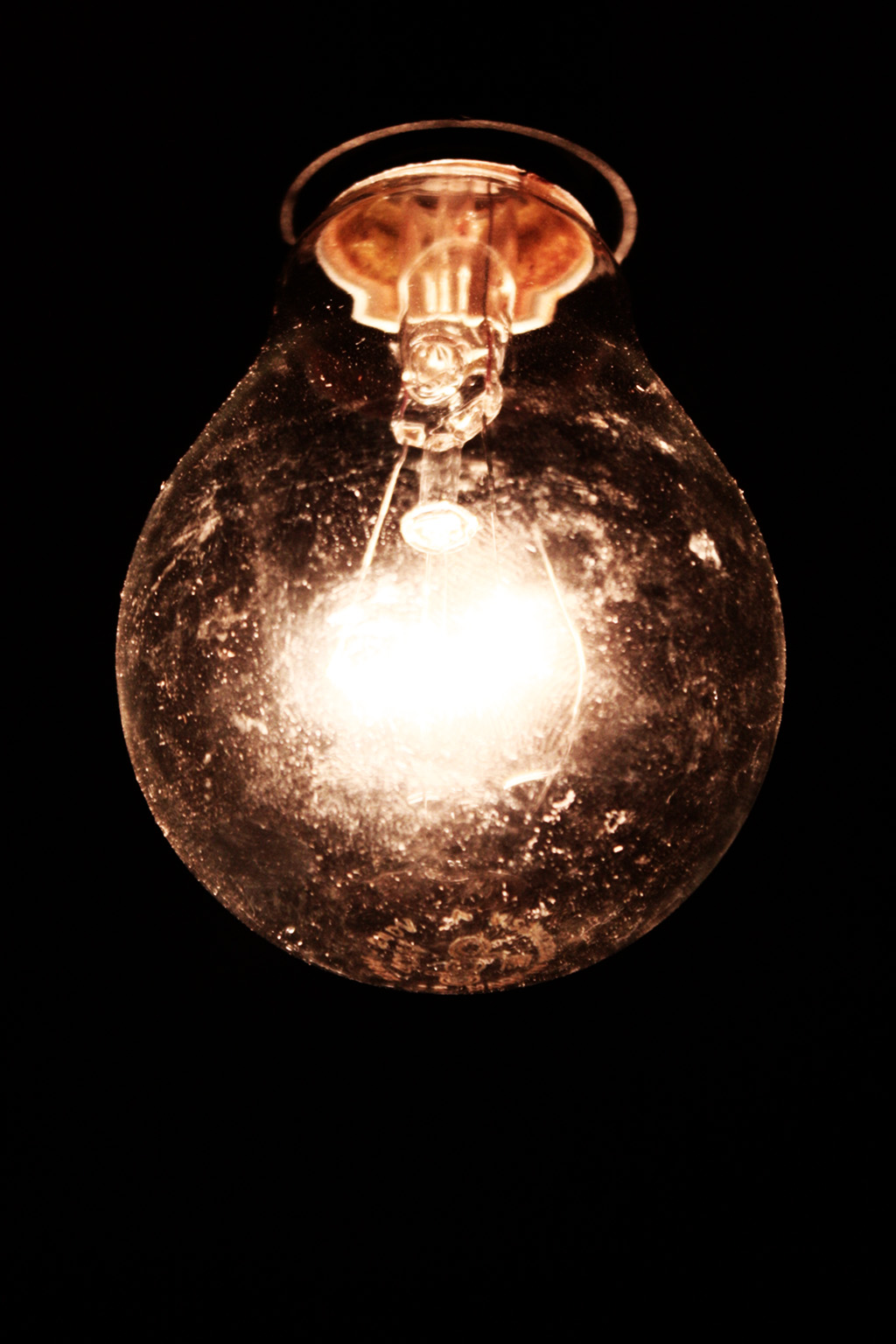 a glass light hanging from the ceiling