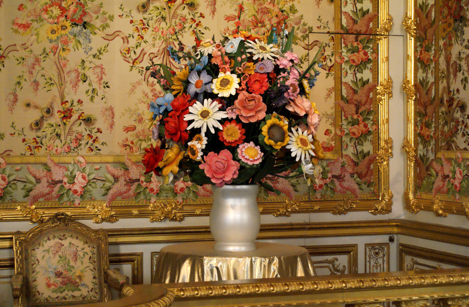 an artistic arrangement of colorful flower bouquet in a vase on a table