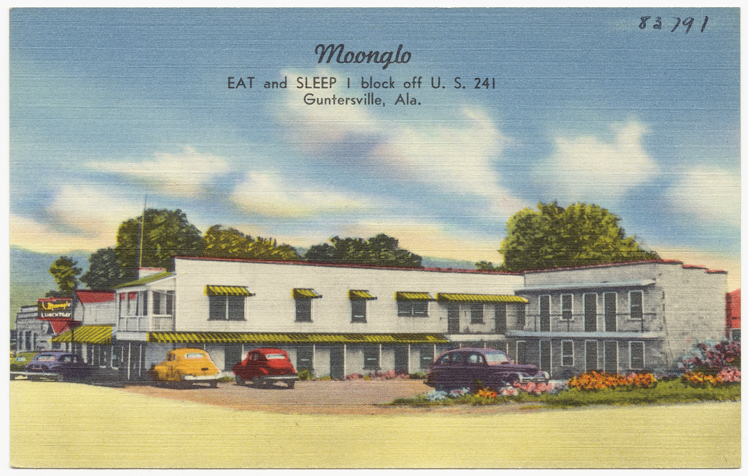 a postcard with cars parked in front of a el