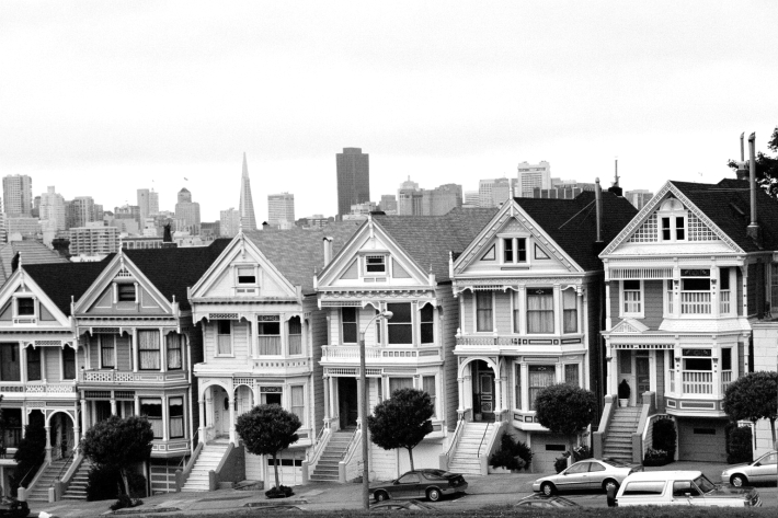 a group of buildings in san francisco, ca with the city skyline in the background