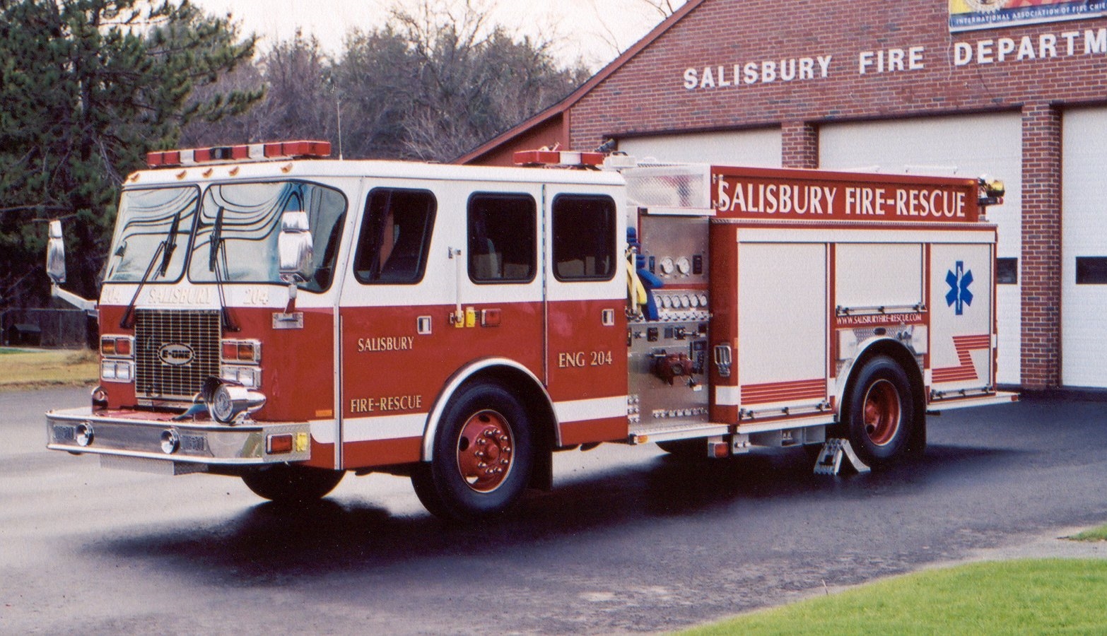 a fire engine parked in front of the fire station