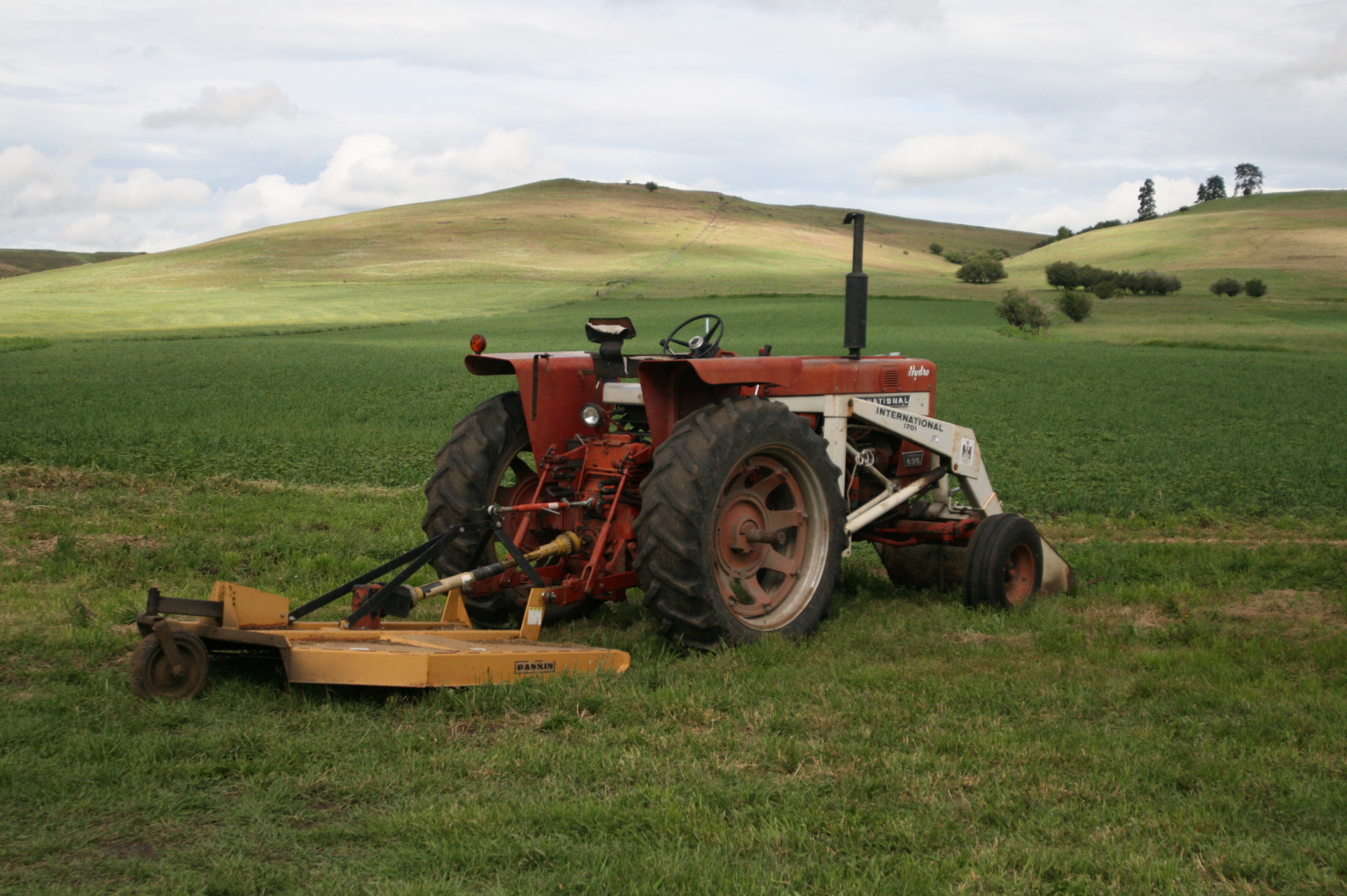 a tractor is parked on the grass