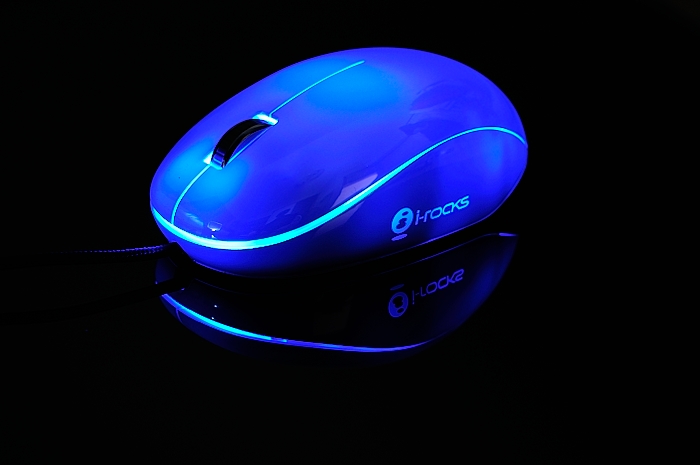 a computer mouse lit up in blue light