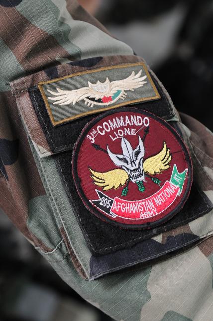 the military uniform has been decorated with patches