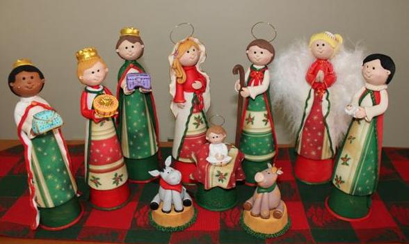 a small group of figurines stand on the table