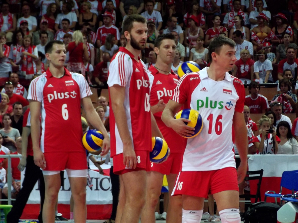 a group of men standing around each other