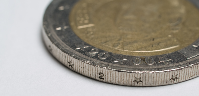 an image of coin close up on a white surface