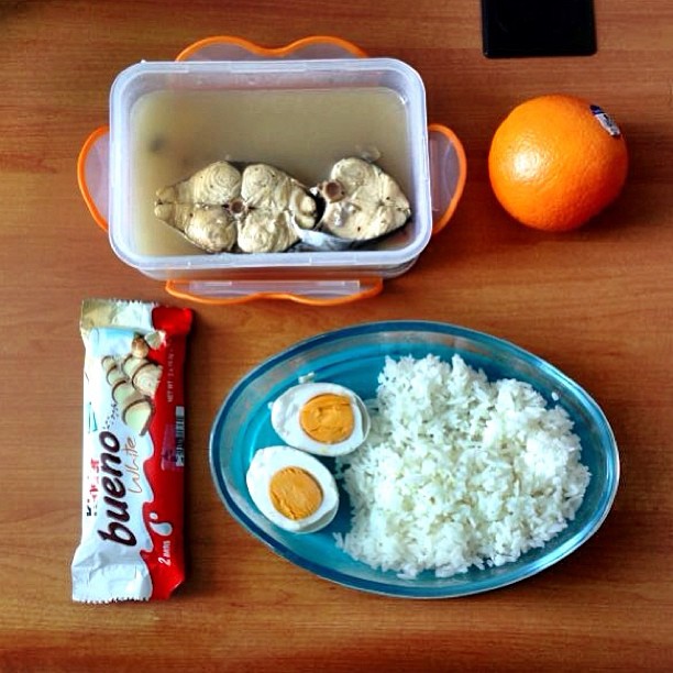 an orange is sitting next to some food