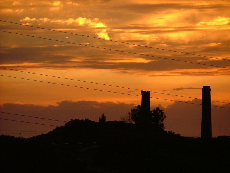 a couple of smoke stacks standing next to each other