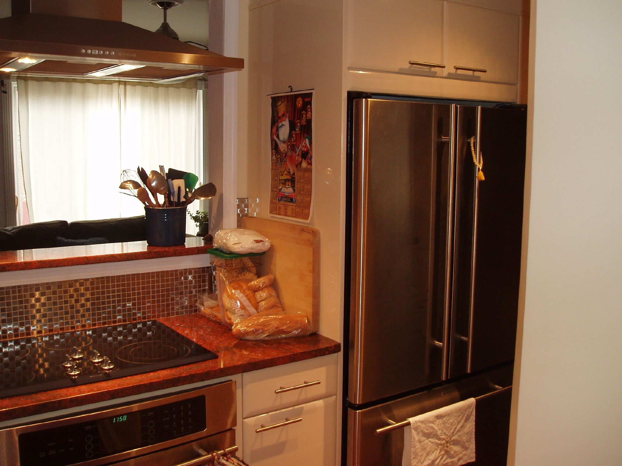 a kitchen with a refrigerator and countertop with food