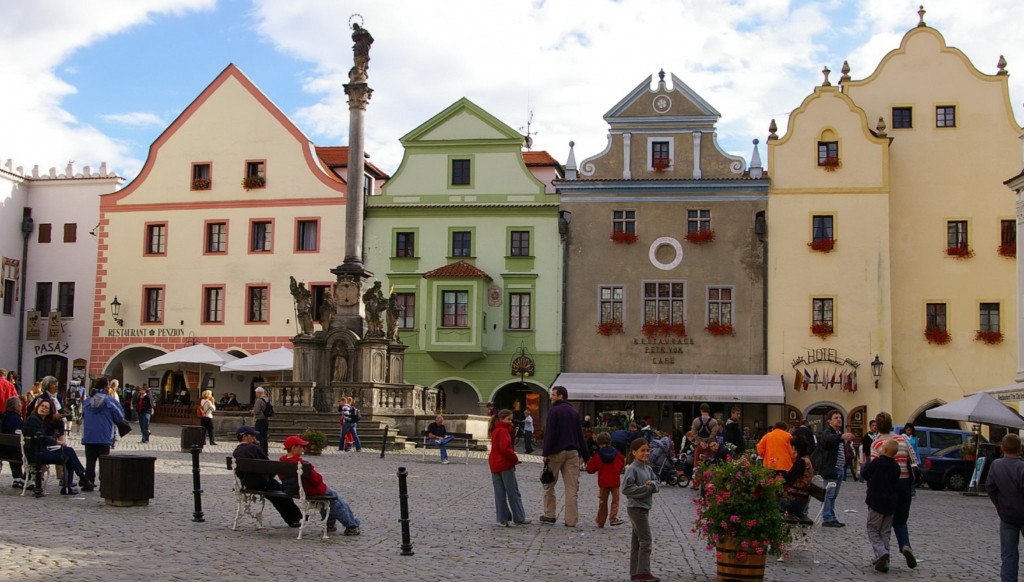 several buildings line the side walk of a european town