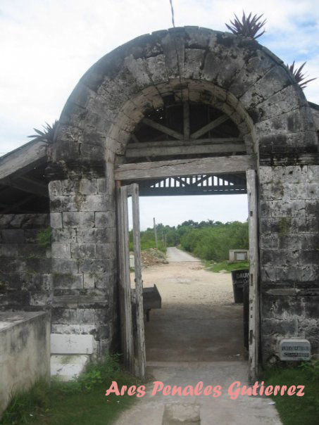 an arched doorway leading to a stone building