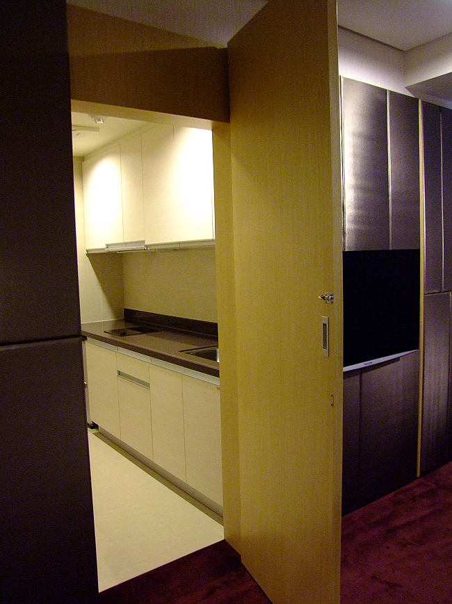 an empty kitchen with cabinets and floors are shown