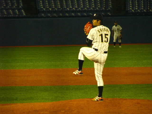 a baseball player getting ready to pitch the ball