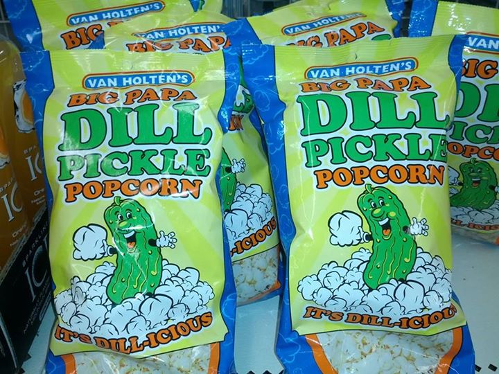 three bags of dll pickle popcorn next to one bag of rice