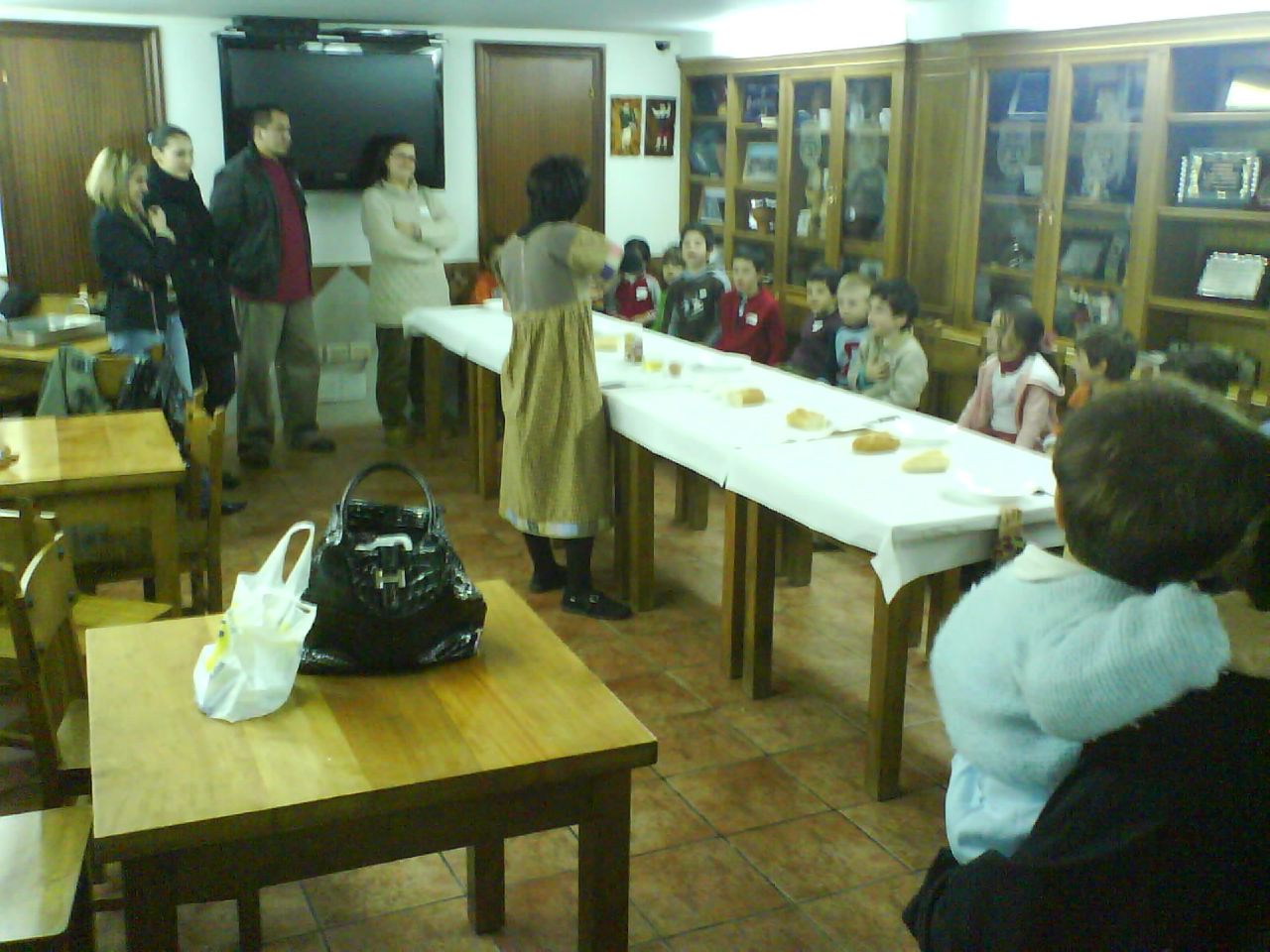 a classroom filled with students and teachers sitting down to learn