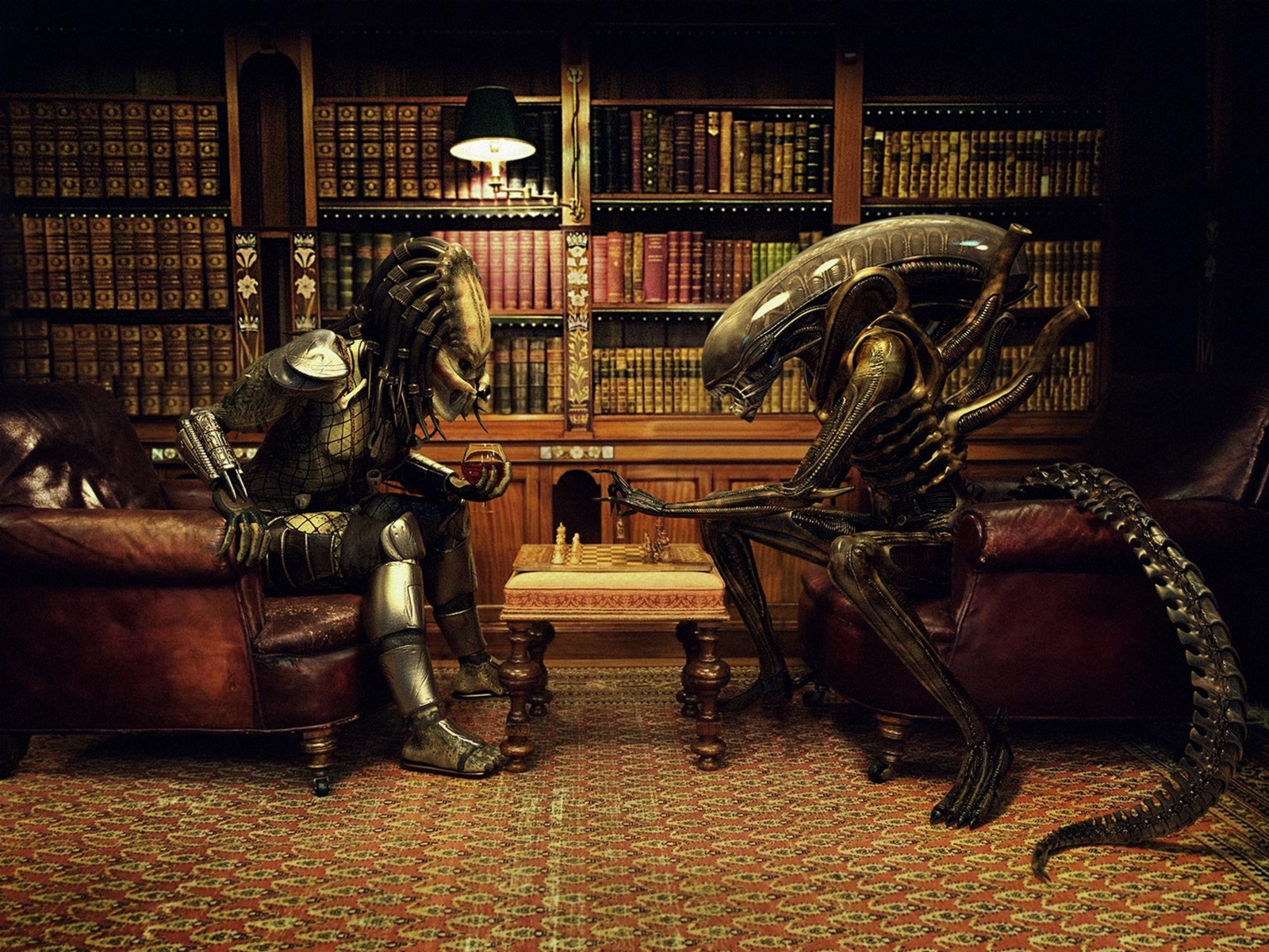 an alien couple sits in front of a bookcase