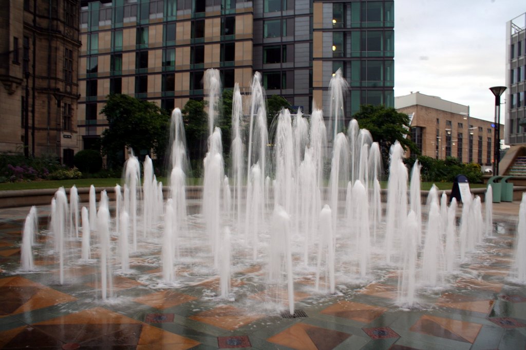 a group of large white fountains spewing water