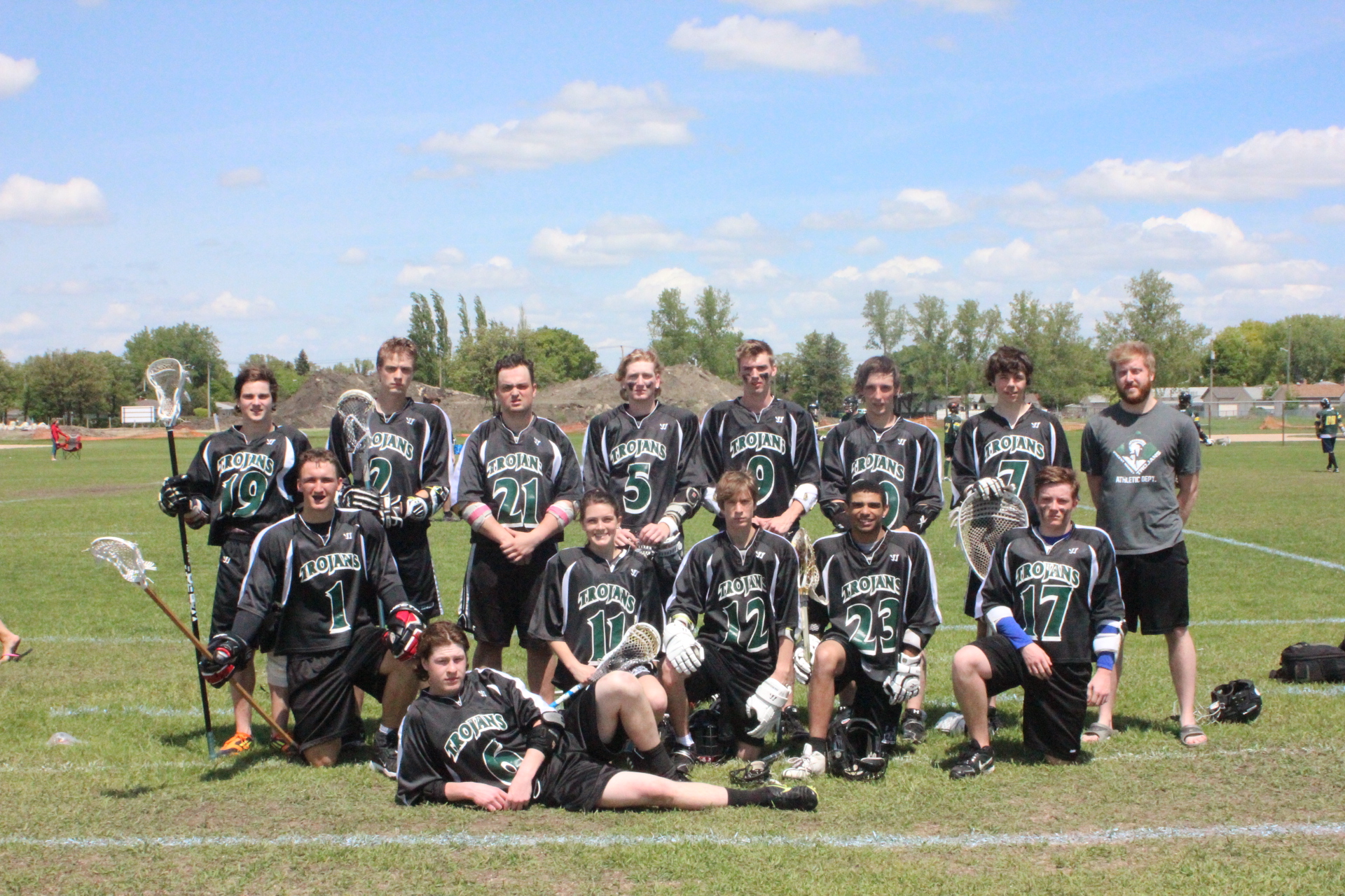 a lacrosse team poses for a team po