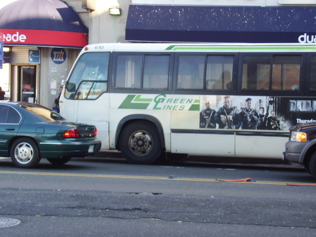 a city bus parked on the side of the road