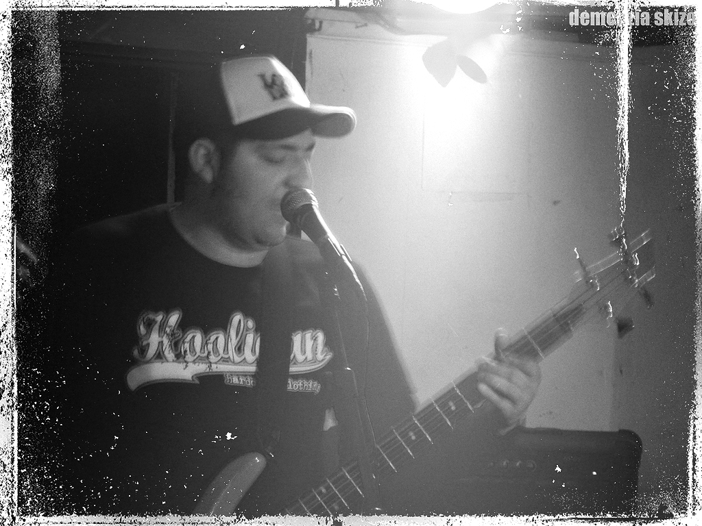 black and white pograph of a man playing guitar