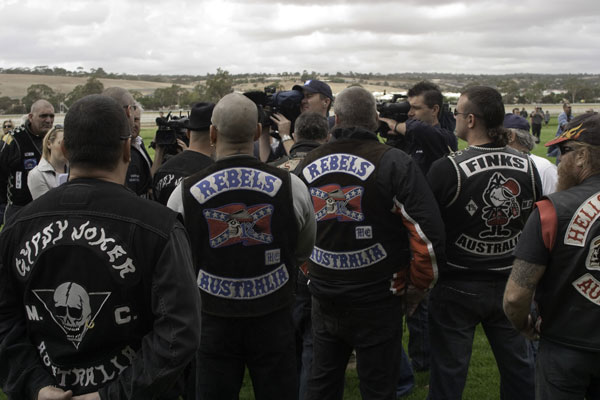 the bikers are standing in a row for a pograph
