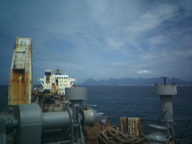 a ship deck with several old and rusty items