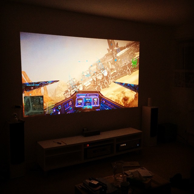 a video game play being projected on the screen