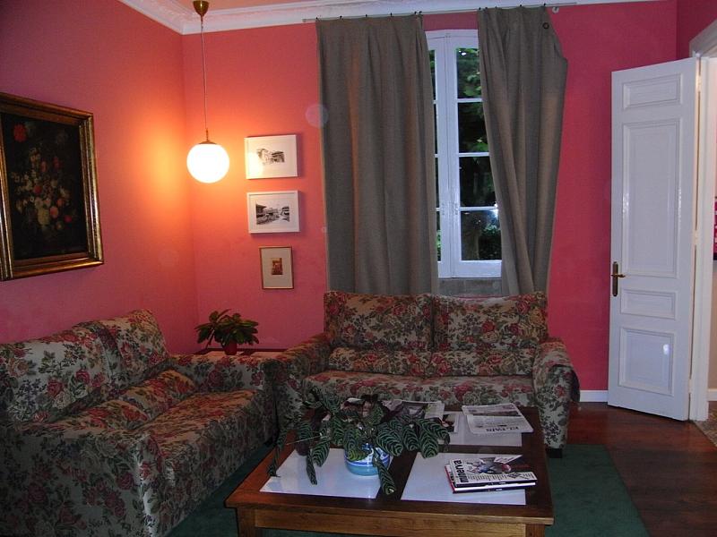 a living room with a couch a table and chairs