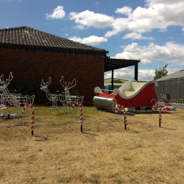 several holiday themed objects in a yard with grass