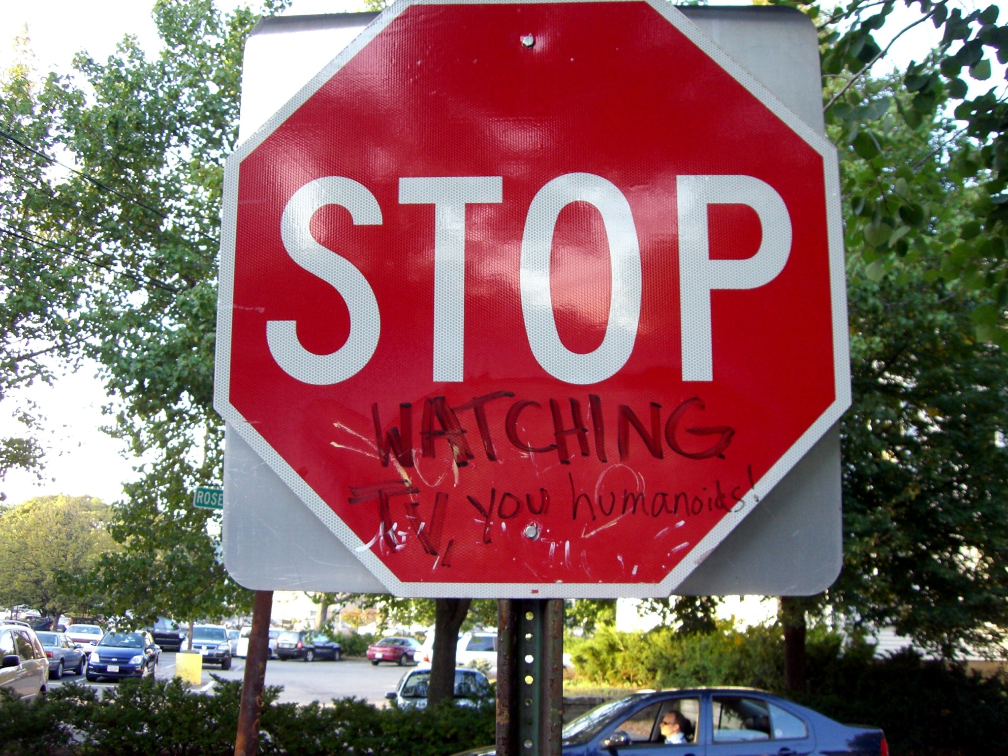 a stop sign that has been vandalized with graffiti