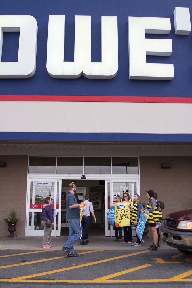 a group of people outside of a walmart