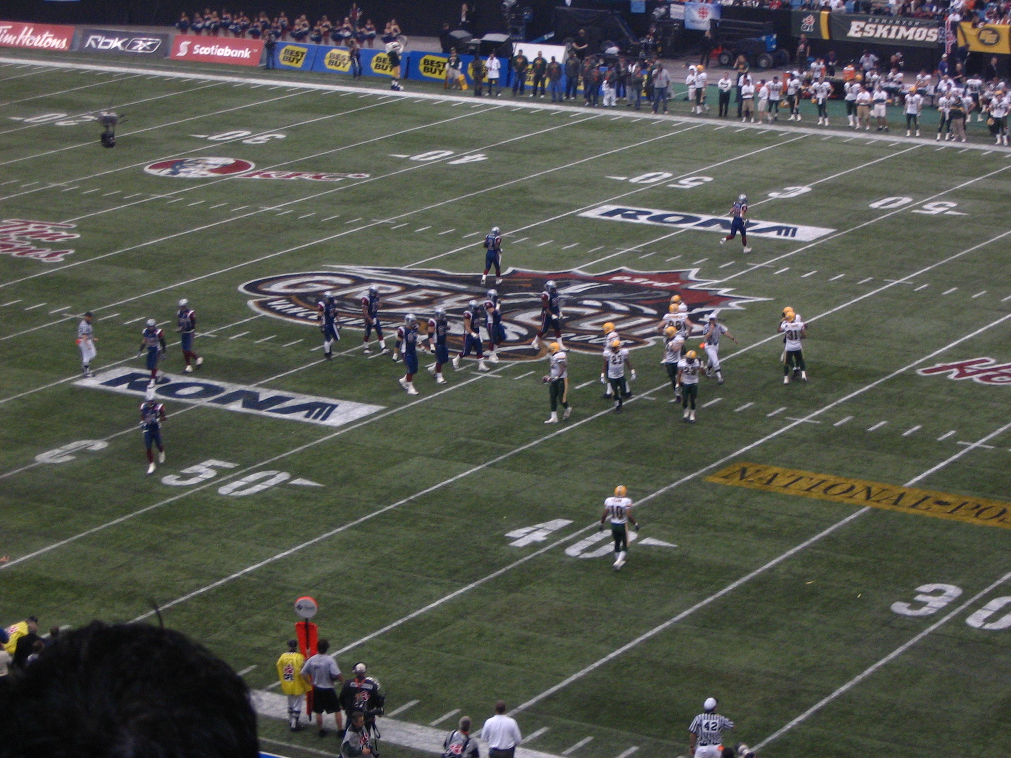 a football game is in action at a stadium