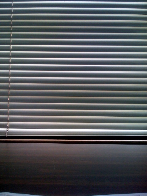 a window with some blinds drawn in