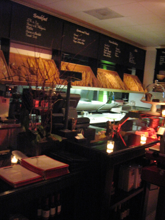 an empty restaurant, with many menus on the board