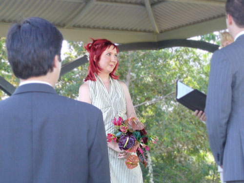 a couple with red hair stand next to each other