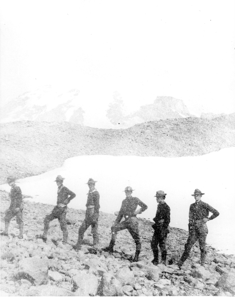 black and white pograph of a group of soldiers standing on the shore