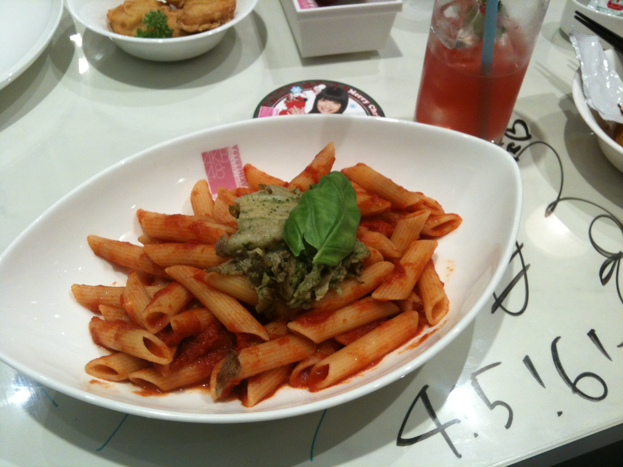 a bowl filled with pasta on top of a table