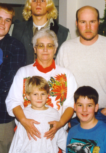the older woman and two children are posing for a picture