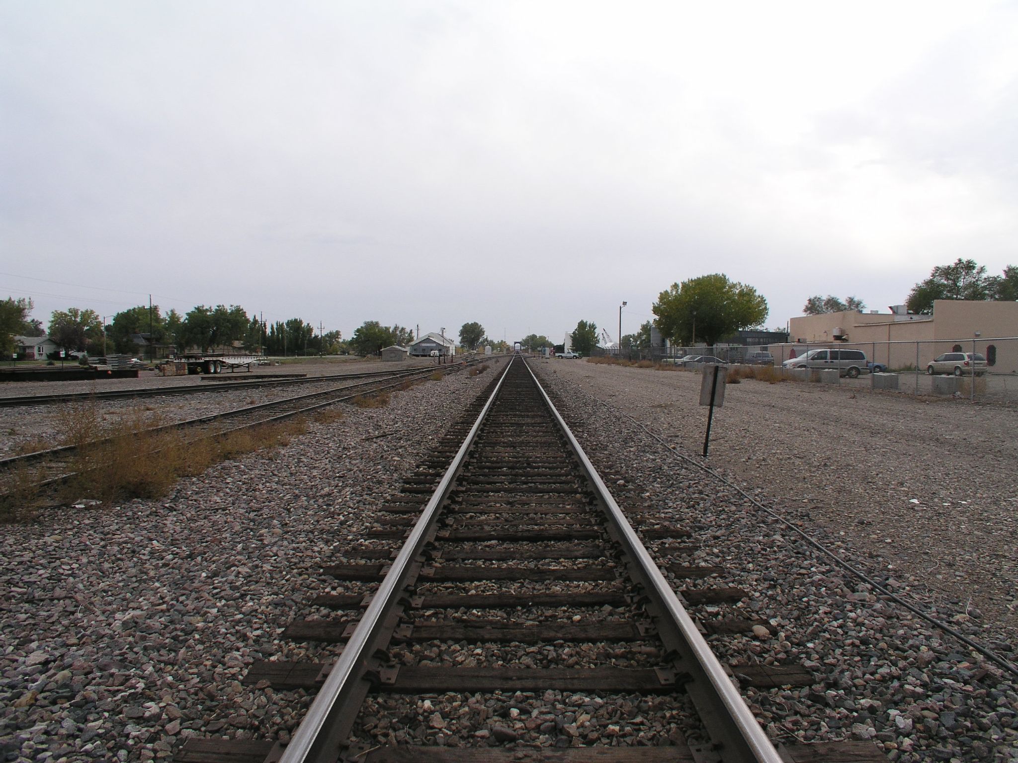 train tracks on the road in a rural area