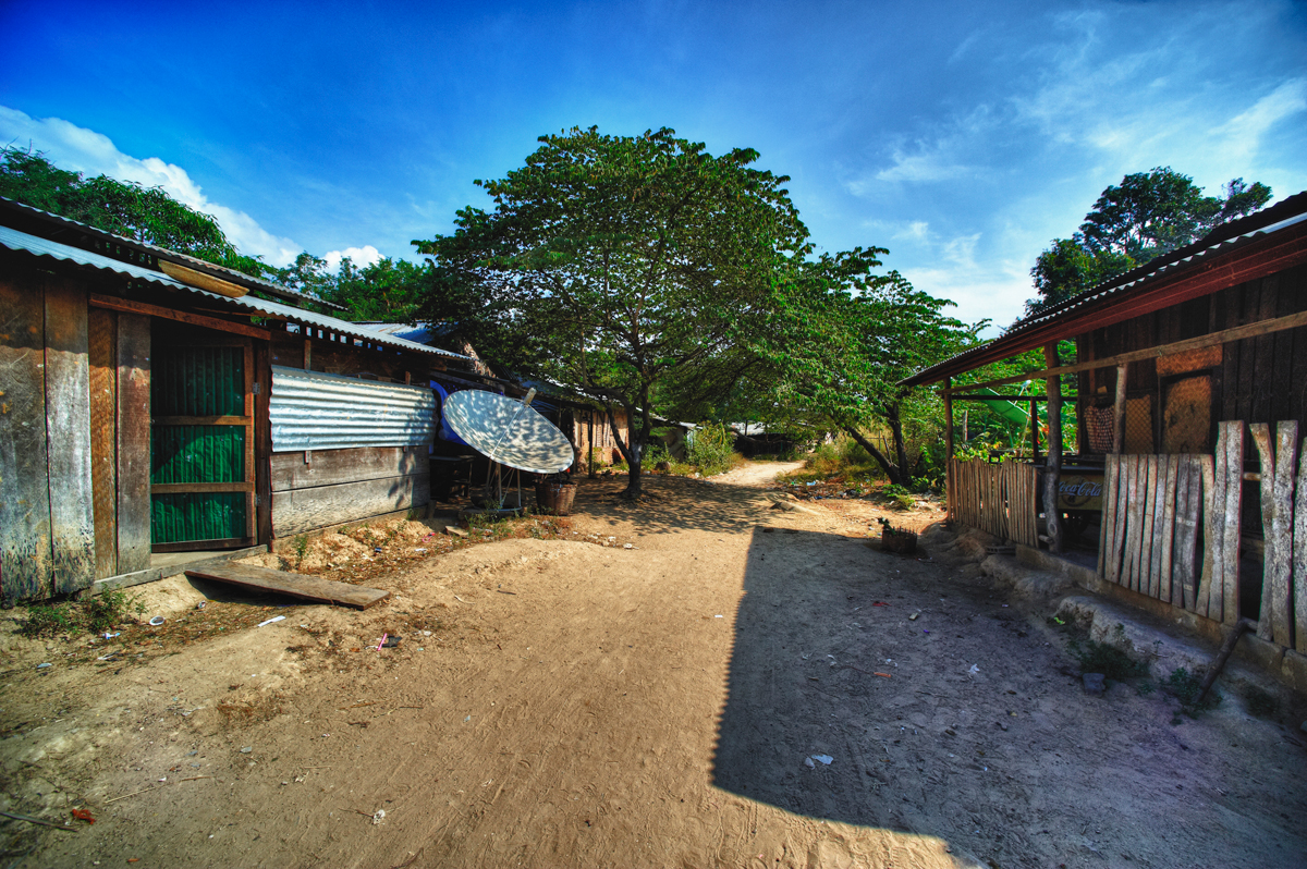 two buildings with surf boards and an alley way