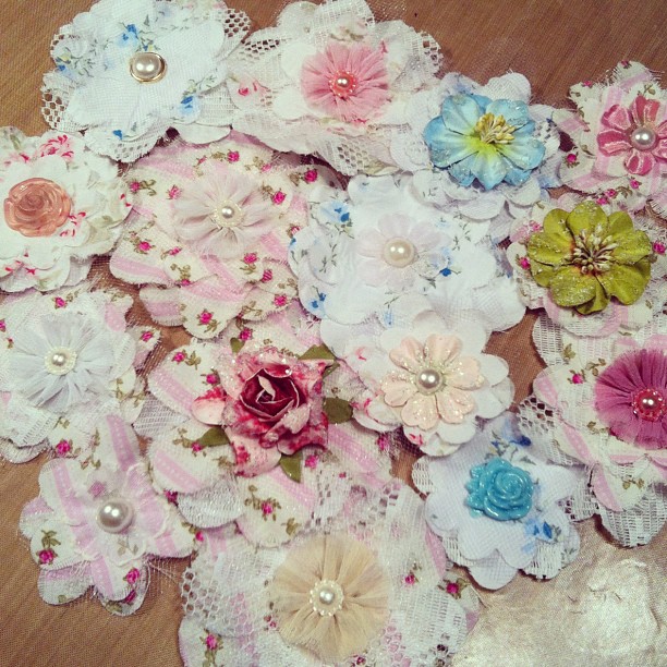 large arrangement of various colored cloth and lace flowers