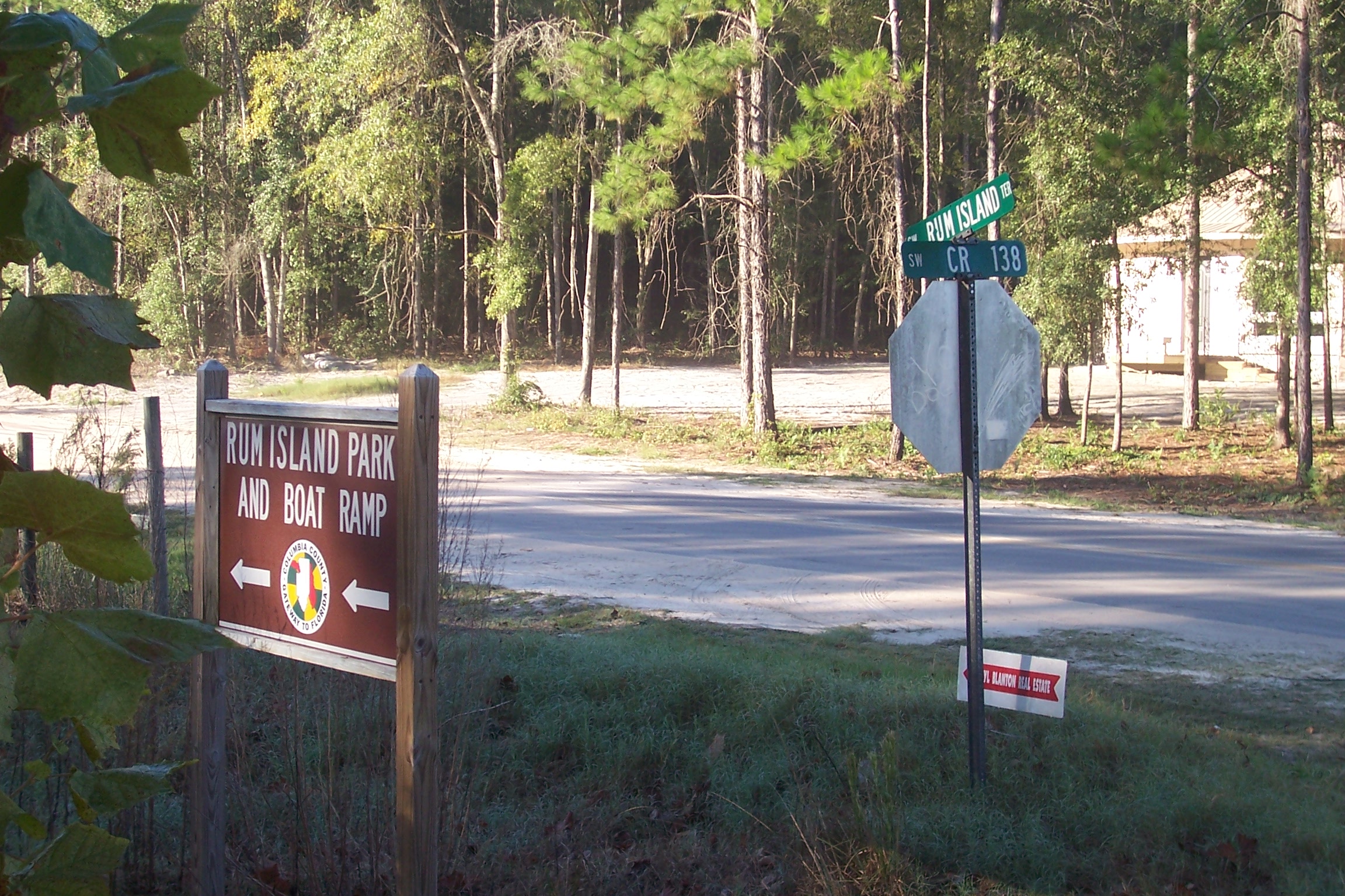 a sign is posted near a forest area