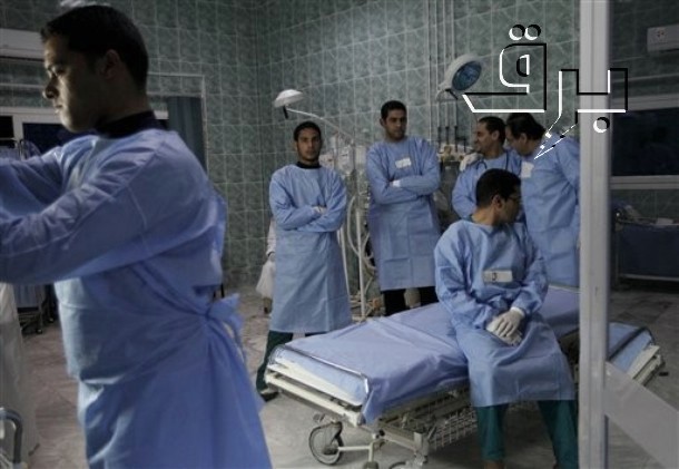 a group of doctors are around a patient in the hospital